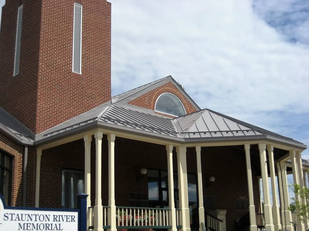 Skilled roofing craftsmen working on a residential roof in Kellogg School